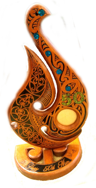 50th Maori Hook with paua on a stand